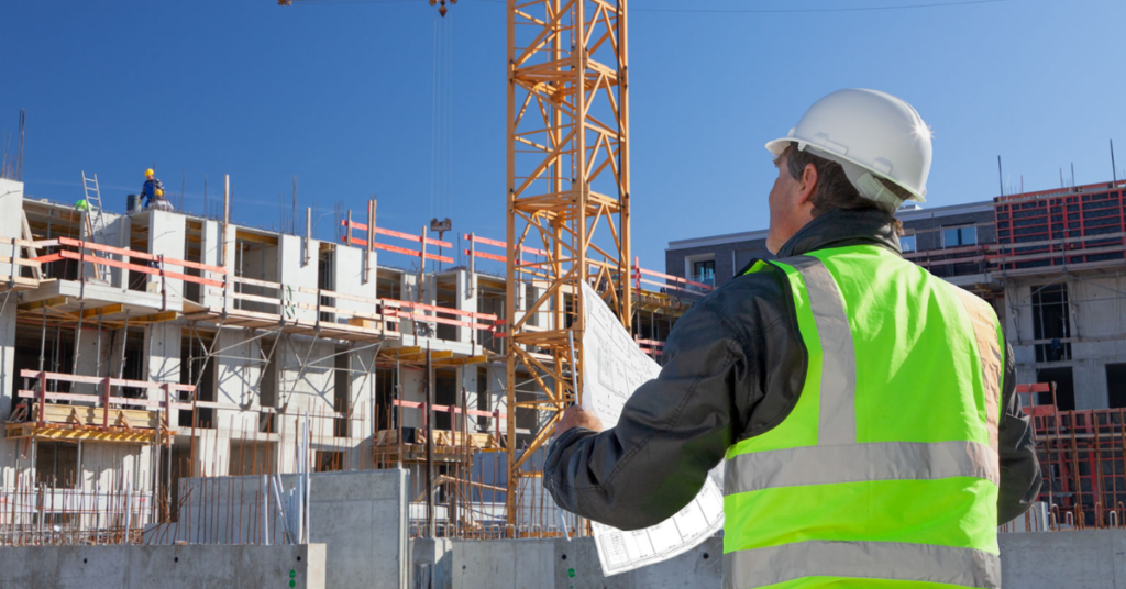 Construction worker viewing as built drawings