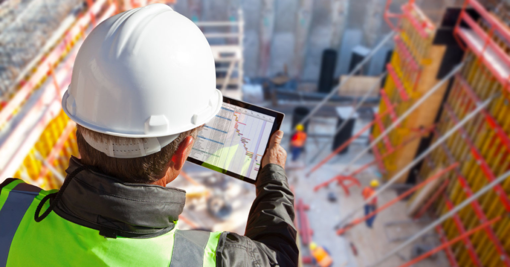 What is BIM coordination in construction? A worker looks at a tablet.